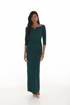 Woman wearing a green dress on a white background