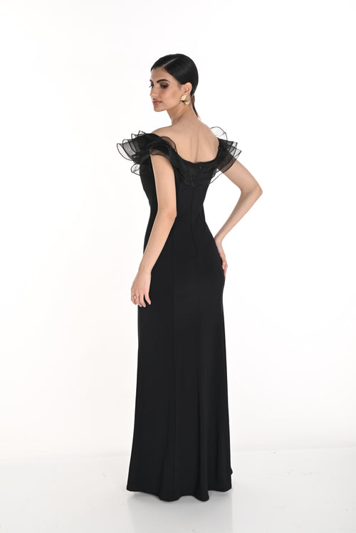 Black evening gown with ruffled sleeves on a white background