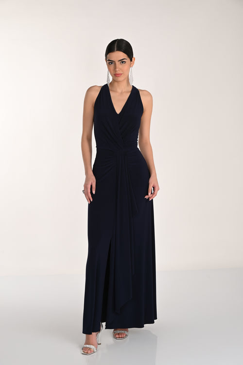 Woman wearing a black sleeveless dress on a white background