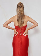 Woman wearing a red dress with a white background