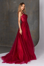 Woman wearing a red evening gown against a neutral background