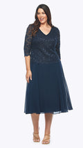 Woman wearing a navy blue dress with lace detailing on a white background