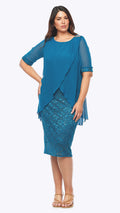 Woman wearing a blue dress with a lace overlay on a white background