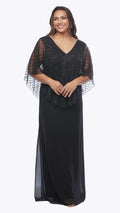 Woman wearing a black evening gown with sheer sleeves on a white background