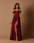 Woman wearing a burgundy off-shoulder gown with a slit on a brown background