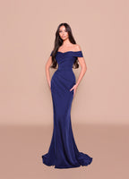 Woman wearing a blue off-shoulder gown on a beige background