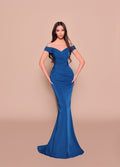 Woman wearing a blue off-shoulder gown against a beige background