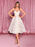 Woman wearing a white lace dress against a pink curtain background