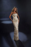 Woman in a long, elegant dress against a dark background