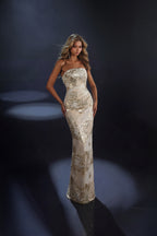 Woman in a long, elegant dress against a dark background