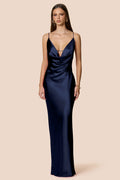 Navy blue evening gown on a beige background