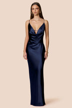 Navy blue evening gown on a beige background