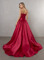 Red evening gown with a plain background