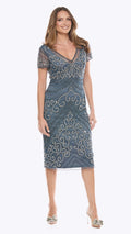 Woman wearing a blue patterned dress on a white background