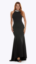 Woman wearing a black evening gown on a white background