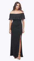 Woman wearing a black off-shoulder gown with a slit on a white background