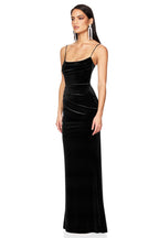Woman wearing a black evening gown on a white background